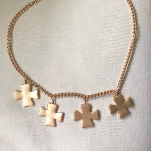 Gold statement necklace by Kenneth Jay Lane